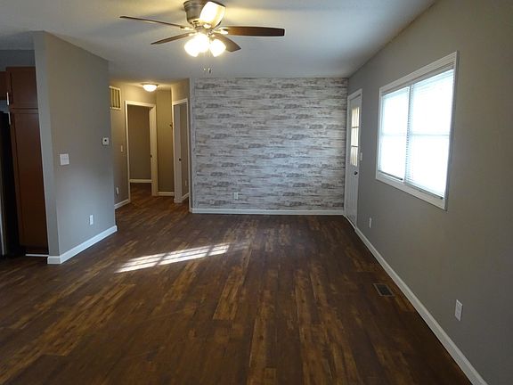 living room with ship lap wall