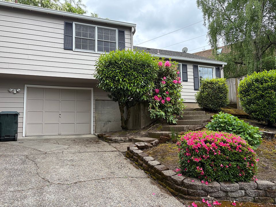 Your home - Private garage, entry and front door. Window above garage is for front bedroom. Windows to the right are for the kitchen and breakfast/dining nook. Plenty of room in driveway for an additional car.
