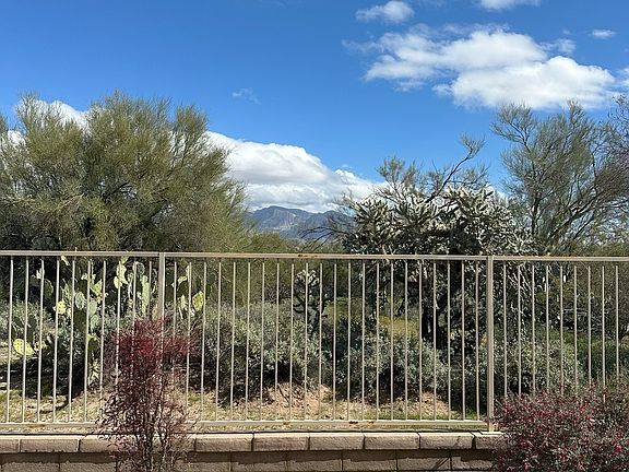 Backyard with view of natural preserve and mountains. No Neighbors behind you!!