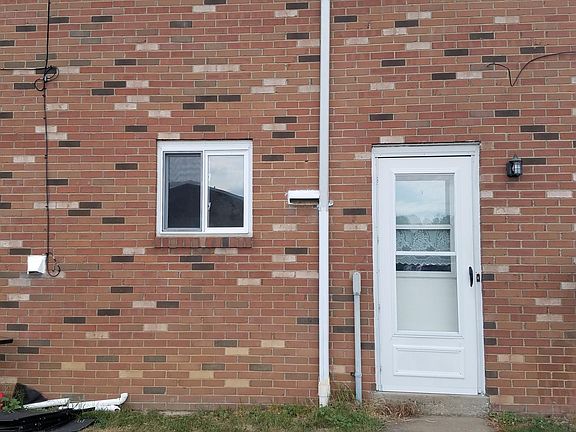 REAR ENTRANCE OFF OF PARKING LOT. UNIT HAS 2 ASSIGNED PARKING SPOTS.