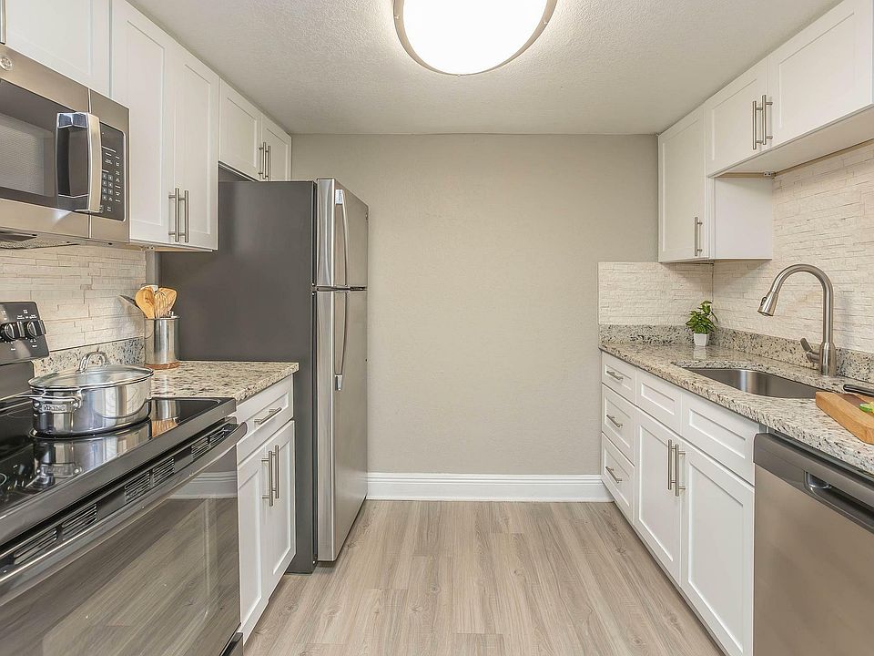 Explore this contemporary kitchen designed with style and convenience in mind.