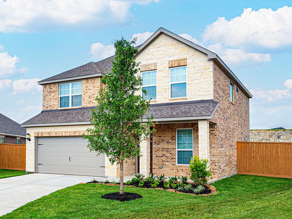 This is a beautiful two story home with brick and stone and front yard landscaping
