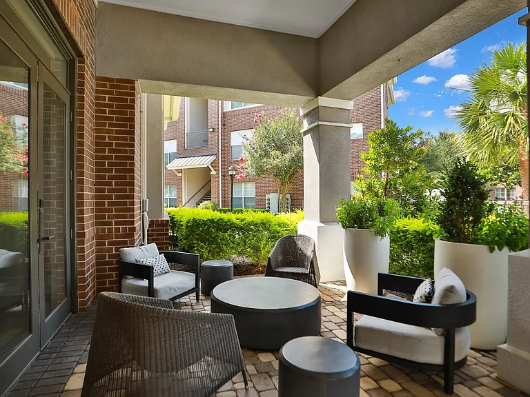 Outdoor Patio Seating at Meadow Apartments in Stafford, TX 77477