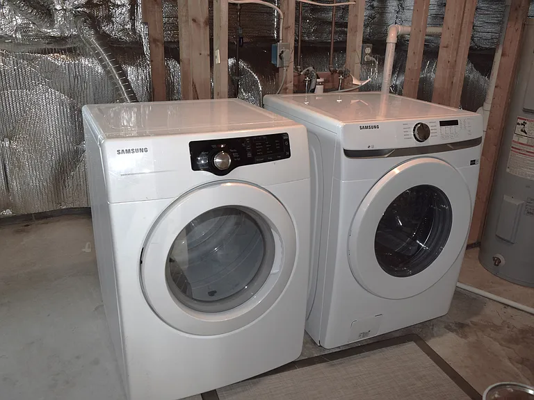 washer and dryer in basement