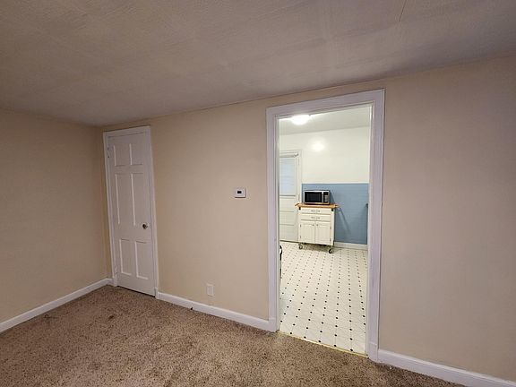 Kitchen that leads off of the living room.