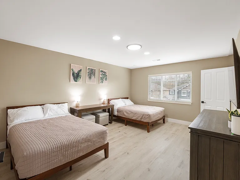 2 Full size beds with 55" wall mounted Smart TV