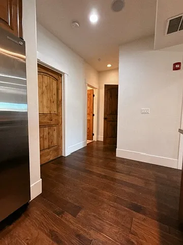 Hallway from Kitchen to Bathroom + Pantry