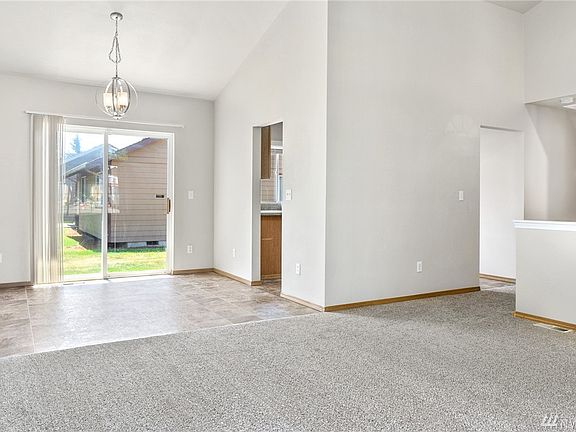 The living room flows effortlessly into the dining area.
