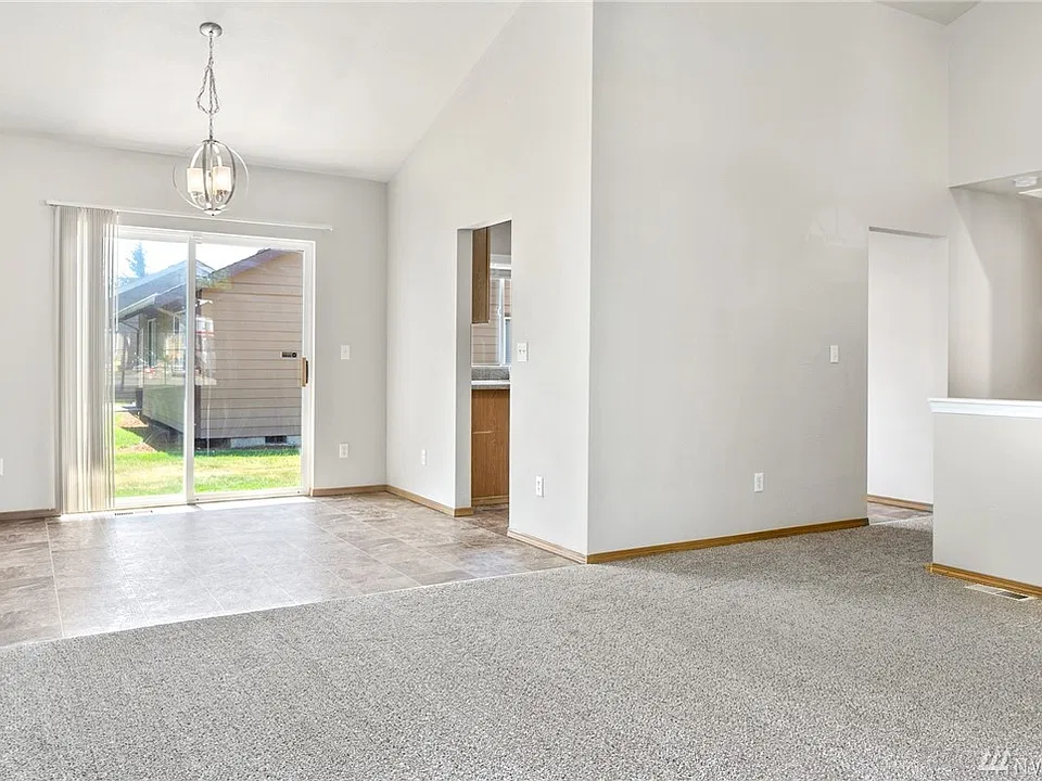 The living room flows effortlessly into the dining area.