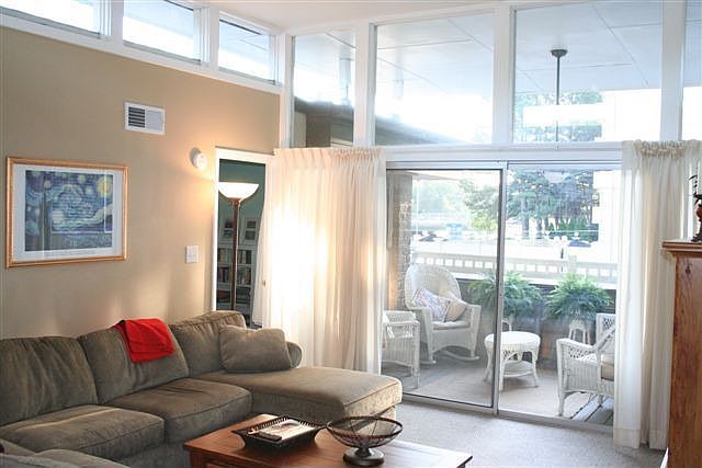 Den with an abundance of natural lighting