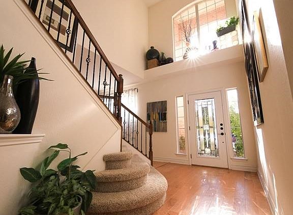 Beautiful foyer with upgrade wood flooring