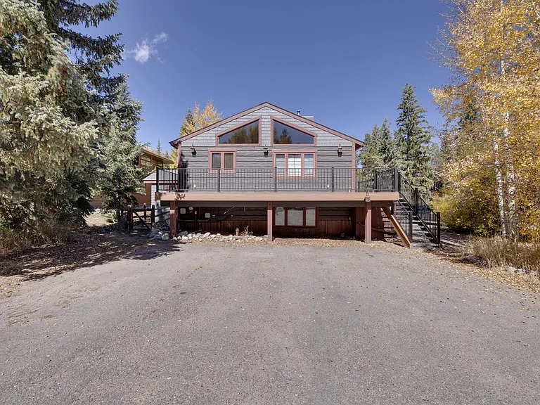 Large parking area in front of house.