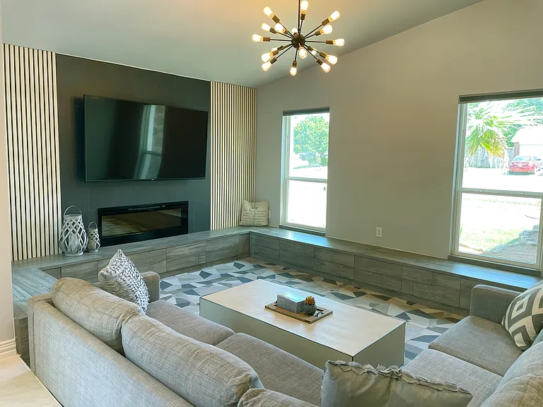 Living Room with 75-inch Smart TV with Urban Style Sleek Electric Fireplace