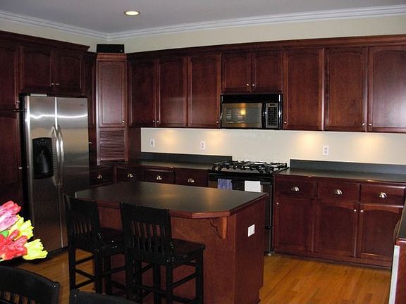 Gourmet Kitchen with Custom Cabinets and Upgraded Appliances