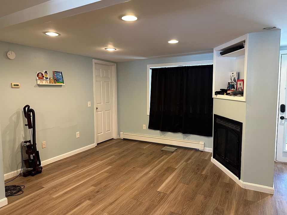 living room showing door to 2nd bedroom