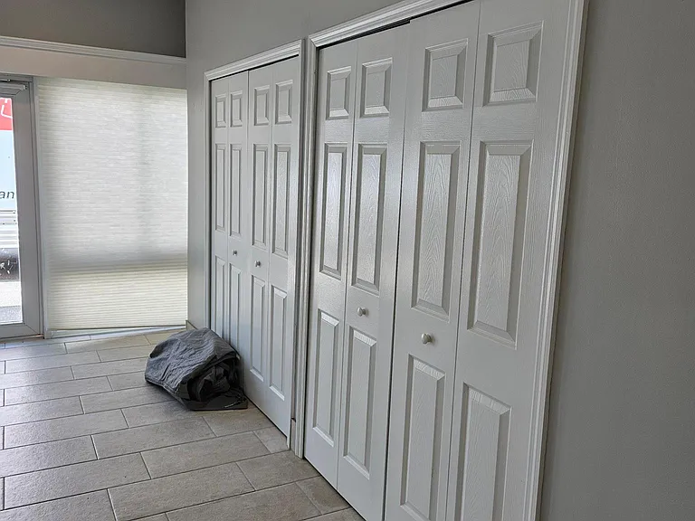 Utility closet with easy access to HVAC and water softener.