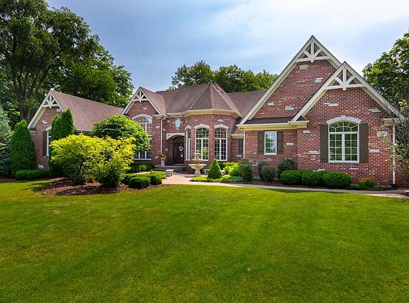 This home is simply beautiful! Classically designed of brick & cedar with stone accents, fabulous ro