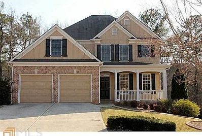 Gorgeous home with a wonderful front porch and beautifully landscaped front yard.