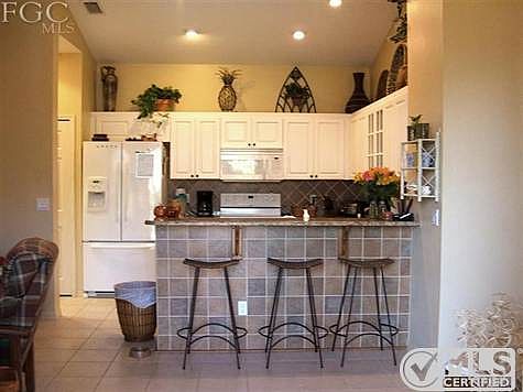 Breakfast bar, French door refrigerator with water and ice in the door.