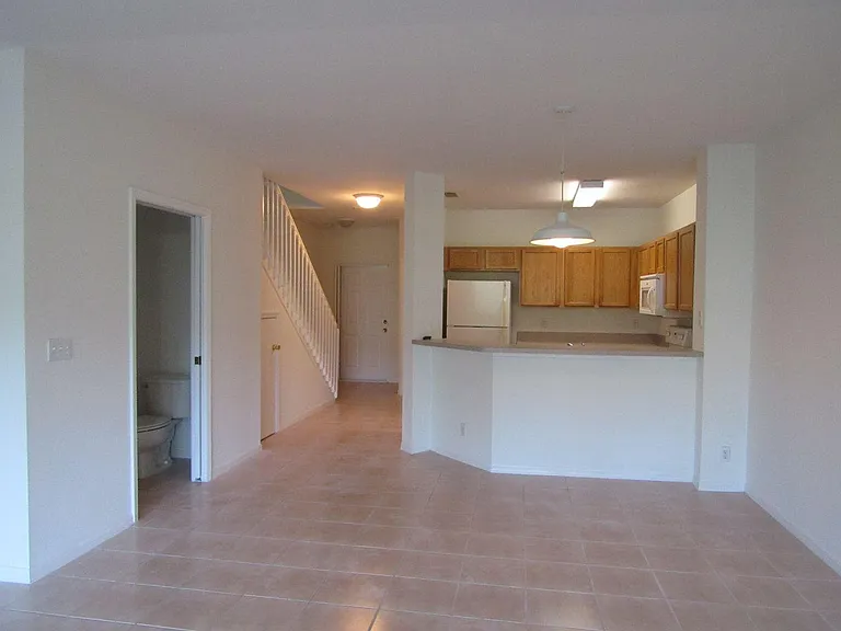 Living room, kitchen, dining, and half bath