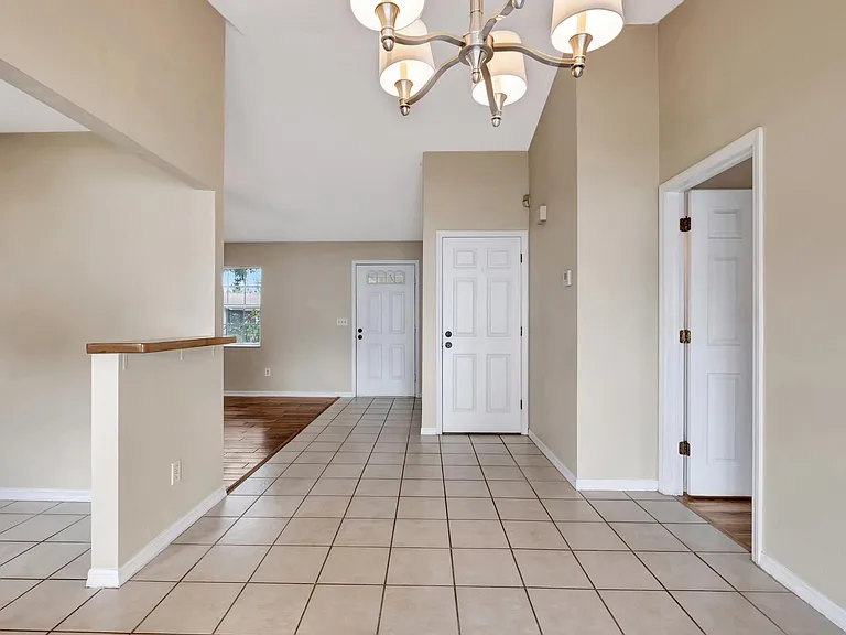 Dining Room. View of foyer & kitchen along with door to garage and master bedroom