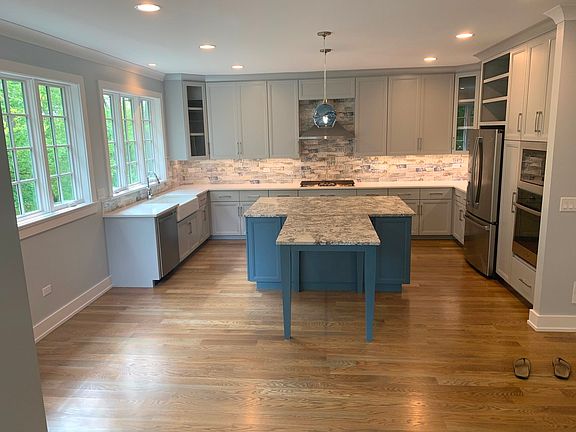 Quartz c'tops with leathered granite island.  Picture windows to the park, all stainless appliances