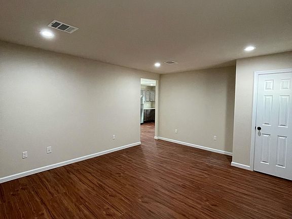 Living room with coat closet.