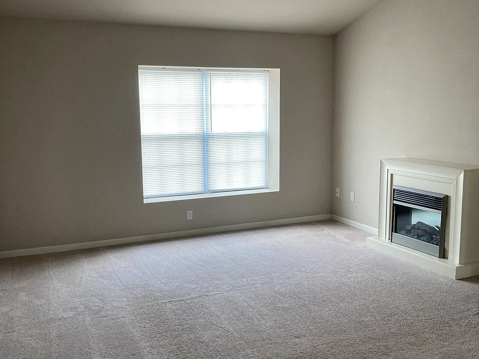 LIVING ROOM WITH GAS FIREPLACE
LARGE PICTURE WINDOW