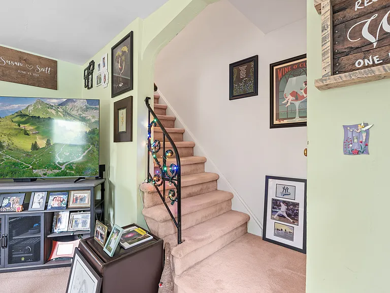 Coat closet at bottom of stairs