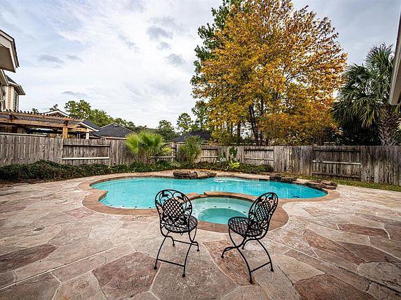Just a lovely spot for coffee or tea in the morning or a glass of your favorite beverage on a warm day! The pool deck is Carvest