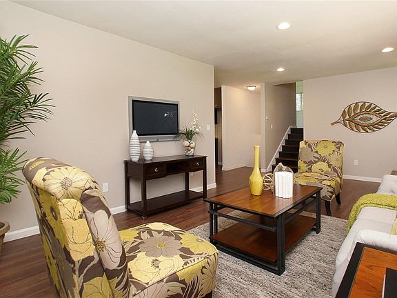 Living room with view of stairs