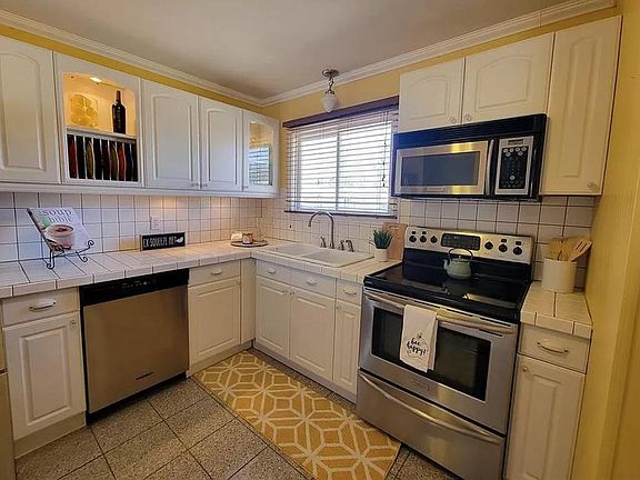 Main kitchen shared with upstairs unit.
