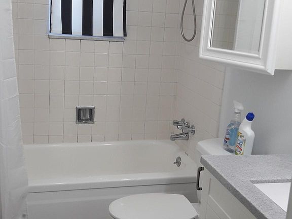 Bathroom. Shower over bath & blind on window