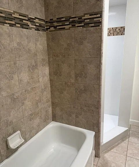 Main Bath room with tub and separate shower. Nice