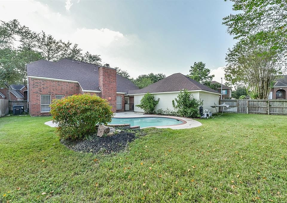 5726 White Mills Drive has a pool in a great back yard that still has room for play! Are you ready to play?