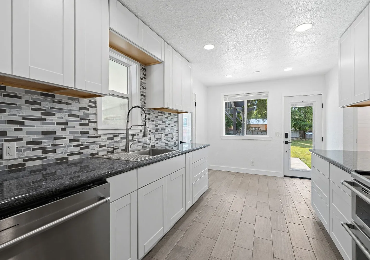 Complete Rebuild Modern Finishes 3 Bedroom 2 Bath Spokane Valley Home fenced backyard — Photo 2