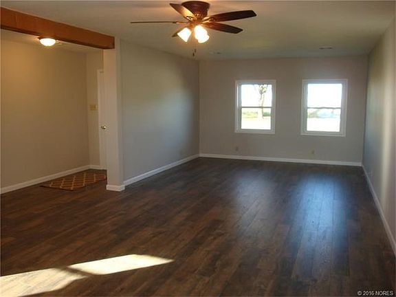 Living room from dining rm. New flooring, windows, lighting, etc. Front door to left.