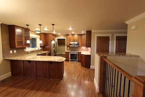 Kitchen with soft close alder cabinets and granite tops