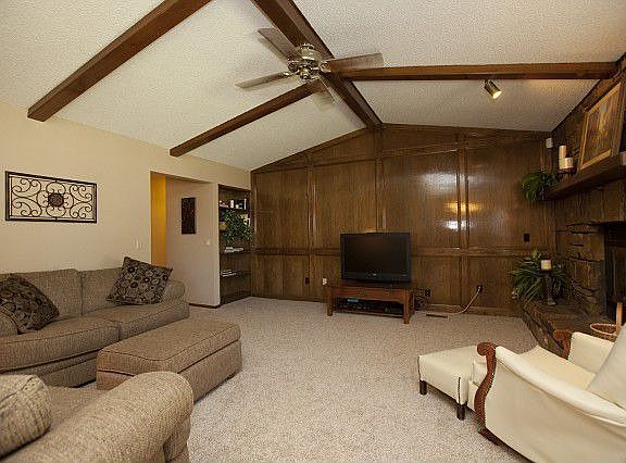 Spacious living room with stone fireplace