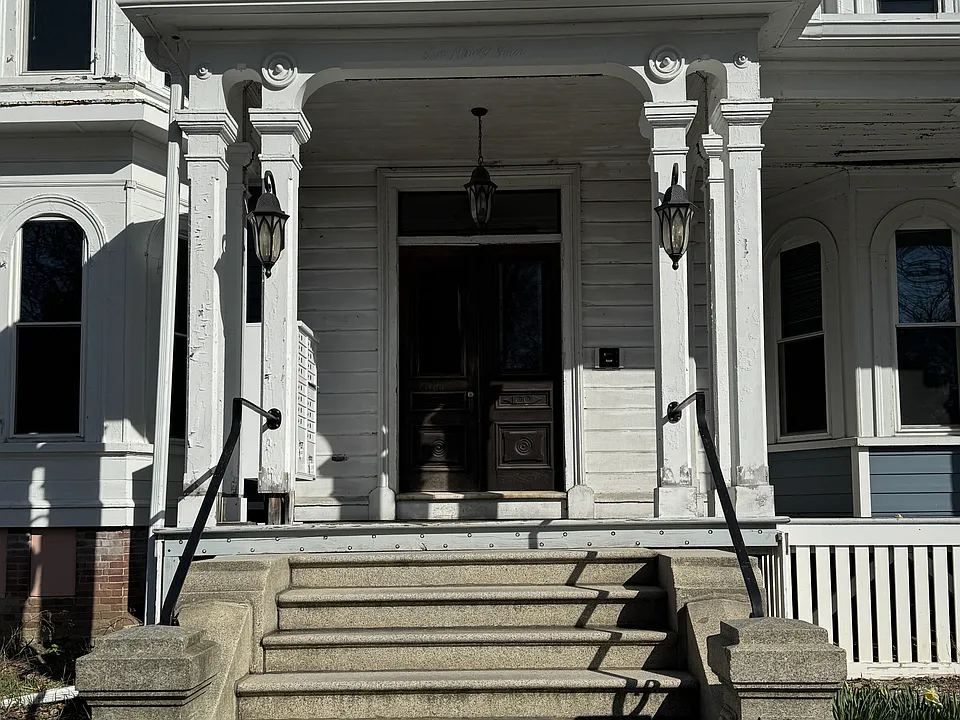 Main entrance to the mansion. This unit is up the granite staircase and up the main staircase. It is right at the top of the stairs on the 2nd floor.