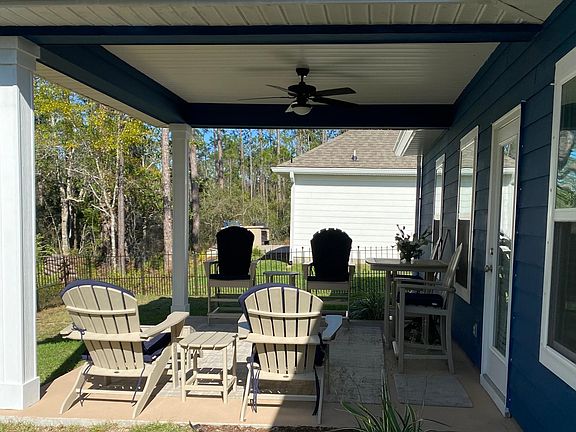 Covered back patio / wooded setting in back of house