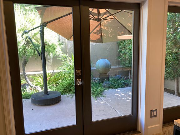 Patio off kitchen and dining room. Two lounge chairs, weber bbq and table for 4