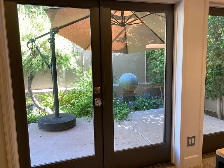 Patio off kitchen and dining room. Two lounge chairs, weber bbq and table for 4