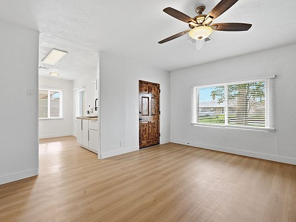 Front entrance leads into large living room with tons of natural light from South and West.