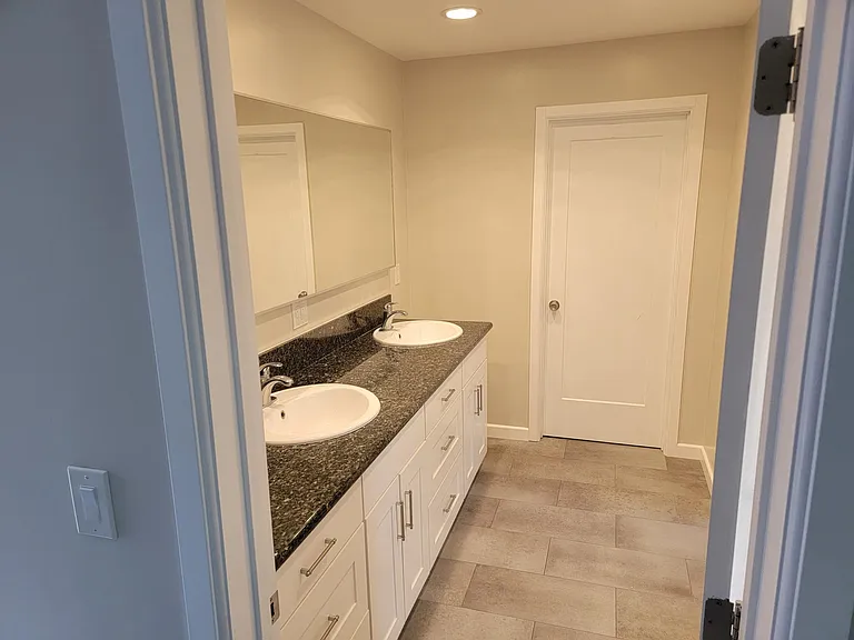 master bathroom with closet door