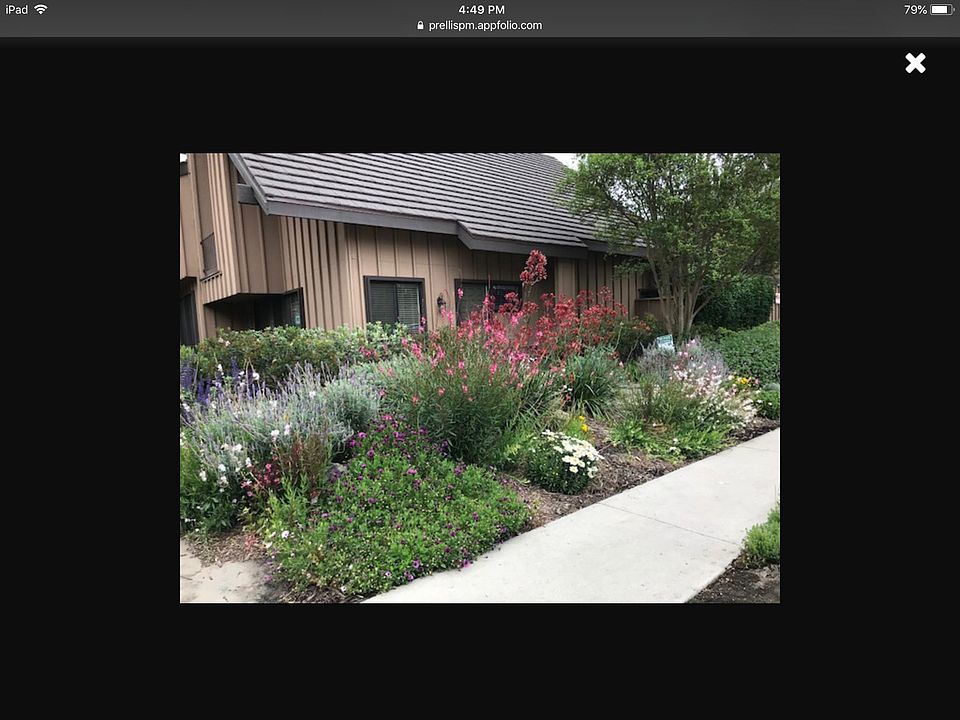 Front private entry with gorgeous landscape makes this TH li