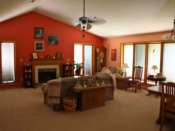 Open great room : Lots of natural light. Pella window shades closed in this picture.
