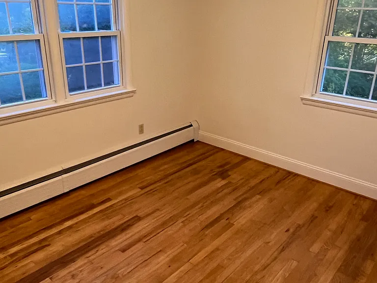 Bedroom with closet- hardwood floors