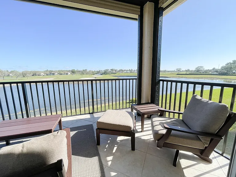 Private Lanai with panoramic screening overlooking 18th green of the Mustang Course at Lely Resort