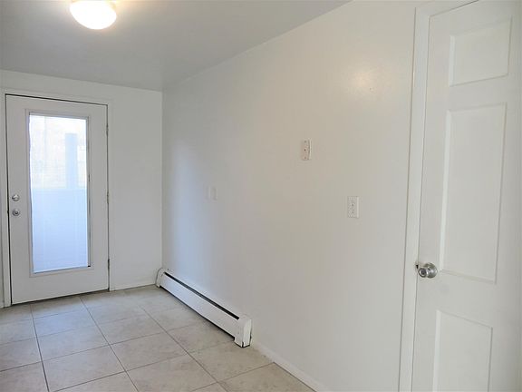 Kitchen showing Rear Access (left door) and Pantry (right door)
